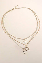 TRIO LAYER HORSESHOE HAT CROSS CAHRM NECKLACE